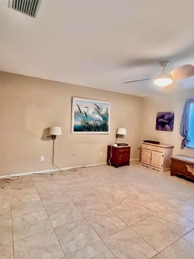 living area featuring ceiling fan