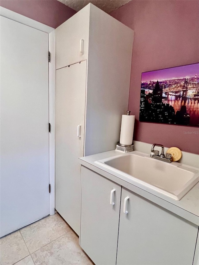 interior space with sink and light tile patterned floors