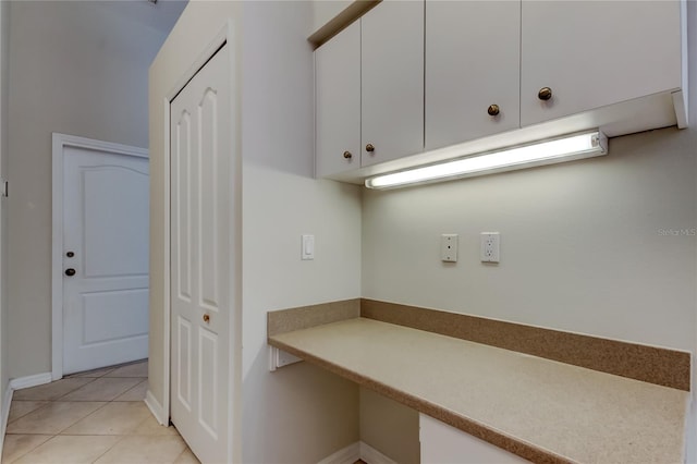 laundry area featuring light tile patterned floors