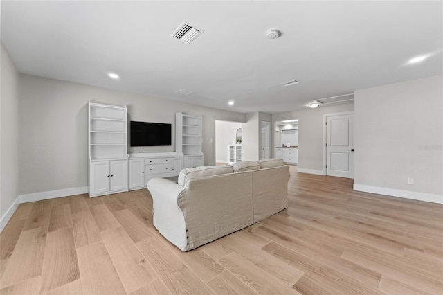 unfurnished living room with light hardwood / wood-style flooring