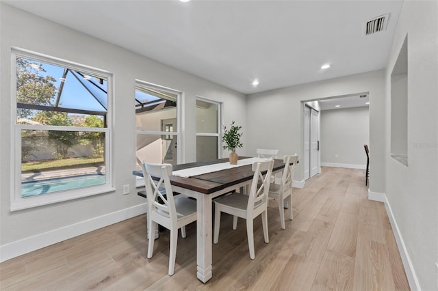 dining area featuring light wood-type flooring