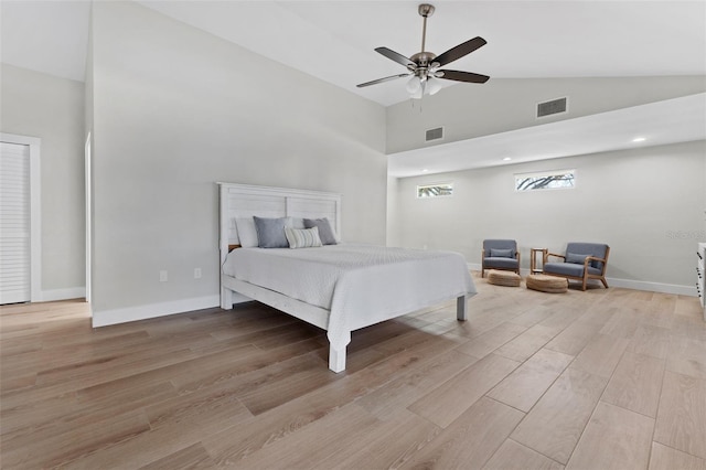 bedroom featuring high vaulted ceiling, ceiling fan, and light hardwood / wood-style flooring