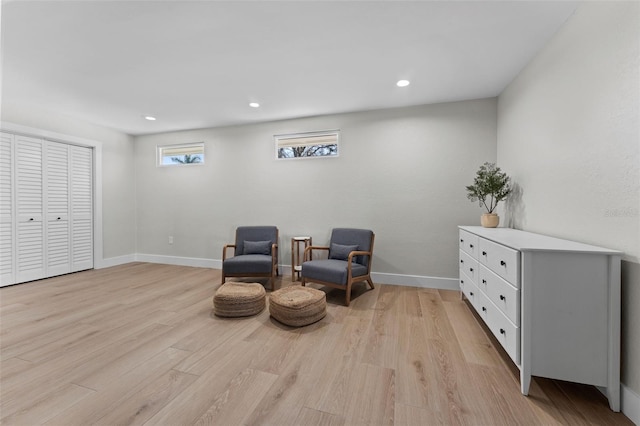 living area with light hardwood / wood-style flooring