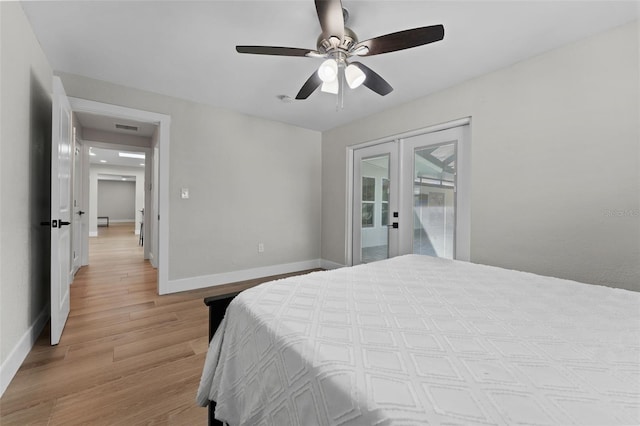 bedroom featuring light wood-type flooring, french doors, ceiling fan, and access to outside