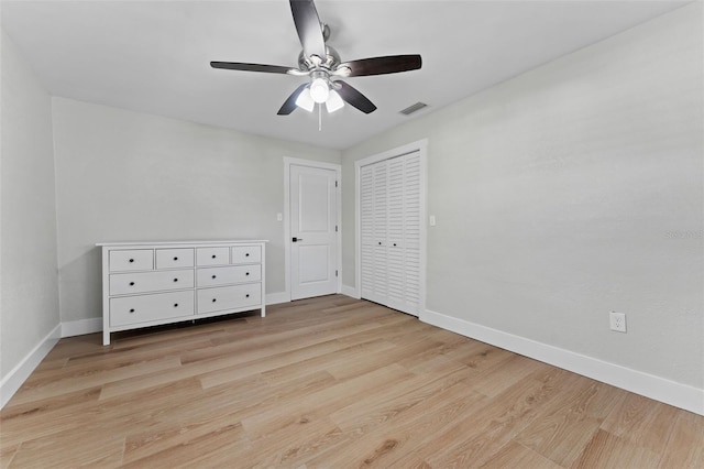 unfurnished bedroom with light wood-type flooring and ceiling fan