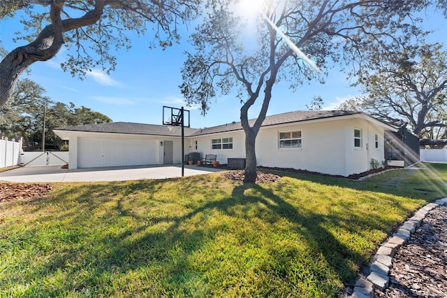 single story home featuring a front yard and a garage