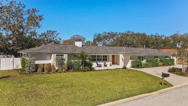 ranch-style house with a front lawn