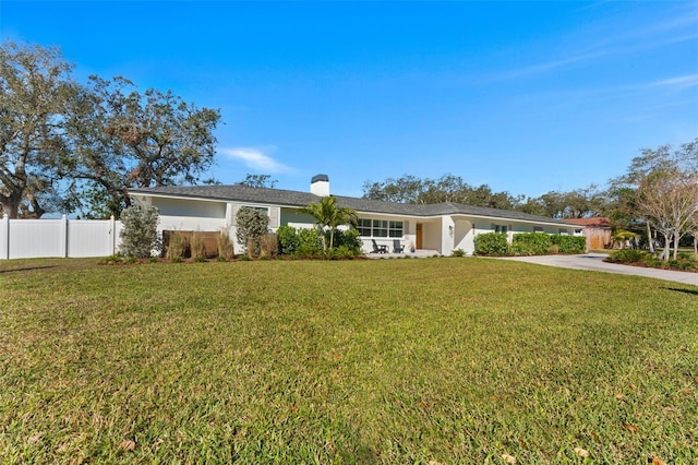 ranch-style house with a front lawn