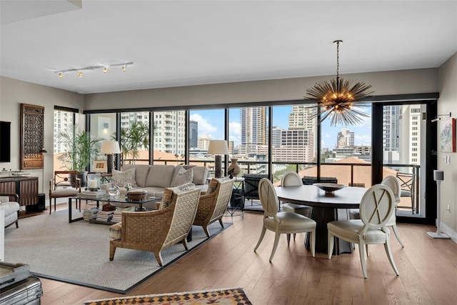 living room with a notable chandelier and hardwood / wood-style floors