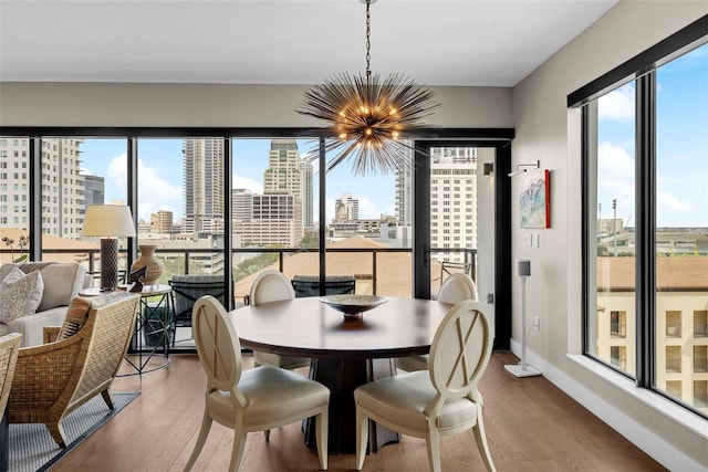 dining room featuring a notable chandelier and hardwood / wood-style floors