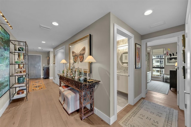 corridor featuring light hardwood / wood-style flooring