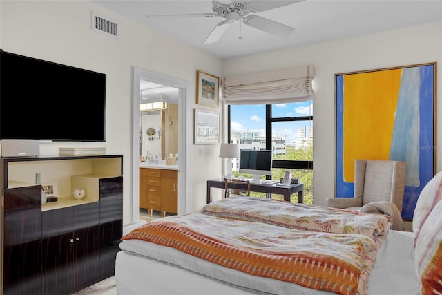 bedroom with ensuite bathroom and ceiling fan