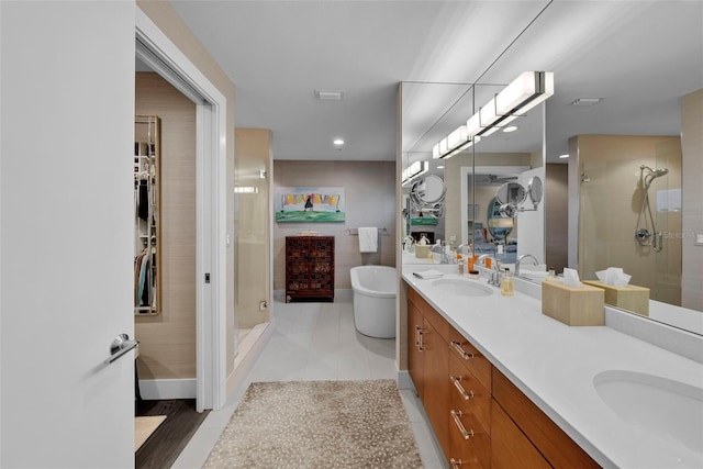 bathroom featuring tile patterned floors, vanity, and independent shower and bath