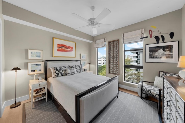 bedroom with ceiling fan and hardwood / wood-style floors