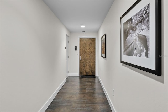 corridor featuring dark hardwood / wood-style flooring