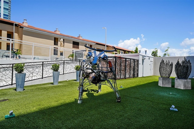 surrounding community featuring a playground and a lawn