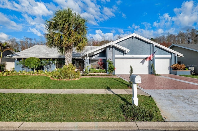 single story home with a garage and a front yard