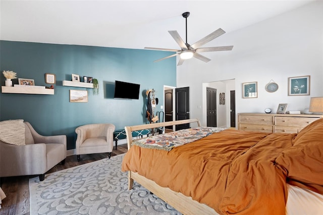 bedroom featuring wood-type flooring, high vaulted ceiling, and ceiling fan