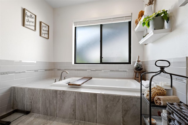 bathroom with tiled bath