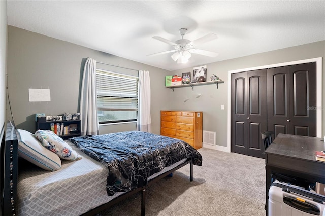 bedroom with carpet flooring, ceiling fan, and a closet