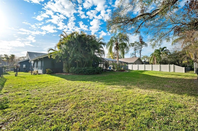 view of yard with a lanai