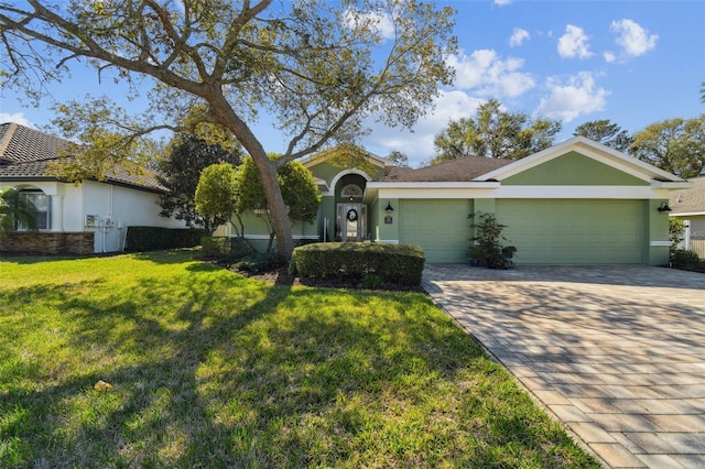 ranch-style home featuring a garage and a front yard