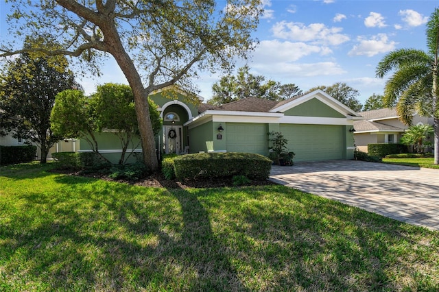 single story home featuring a garage and a front yard