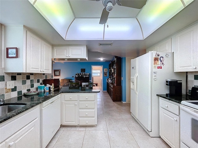 kitchen with visible vents, light tile patterned flooring, white cabinets, and white appliances