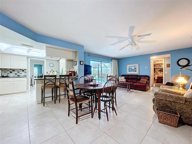 dining room with ceiling fan and light tile patterned flooring