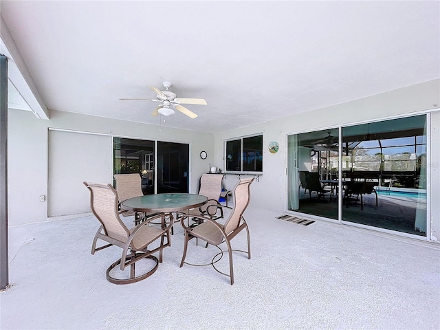 view of patio / terrace featuring outdoor dining space, a ceiling fan, and visible vents