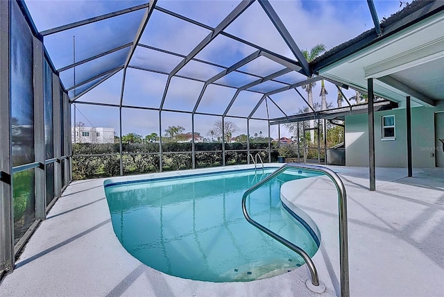 outdoor pool featuring a lanai and a patio