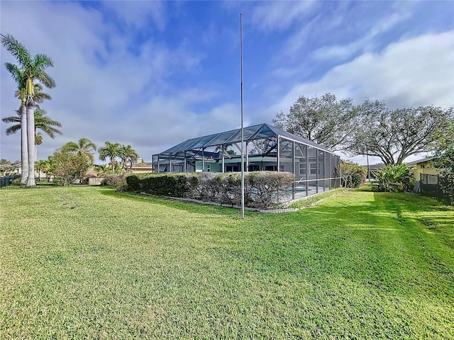 view of yard featuring glass enclosure