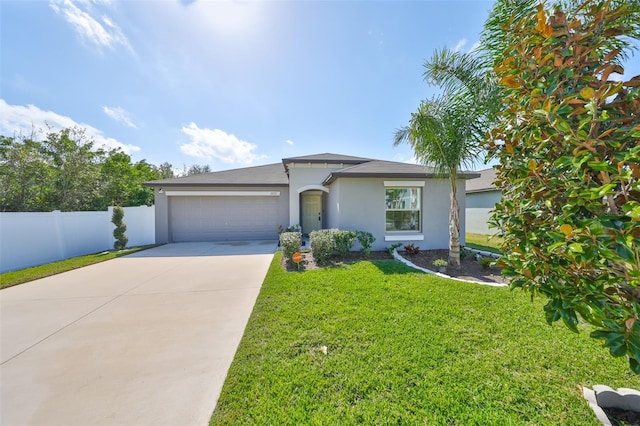 view of front of house with a garage and a front lawn