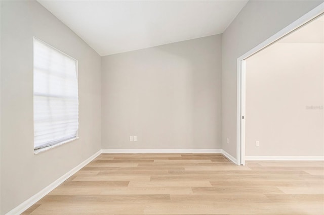 spare room featuring light wood-type flooring