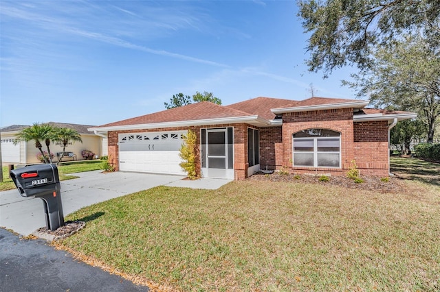 single story home with brick siding, a shingled roof, a front yard, a garage, and driveway