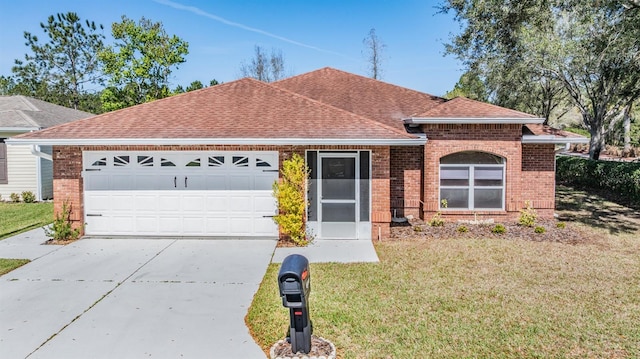 single story home with driveway, a garage, roof with shingles, a front lawn, and brick siding