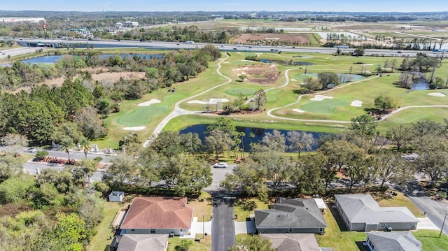 aerial view with view of golf course and a water view