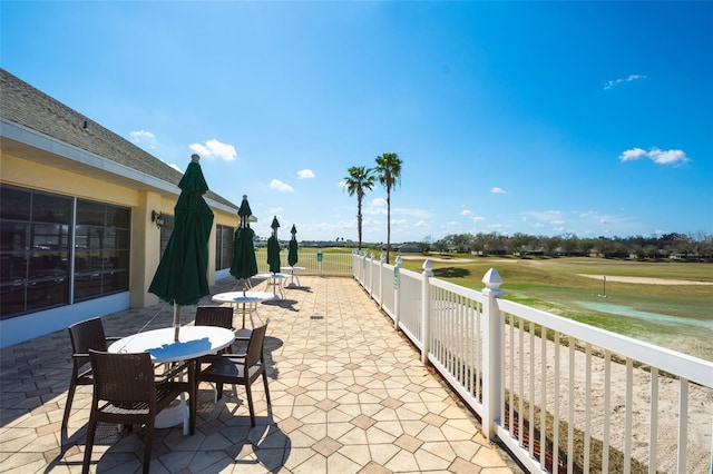 view of patio / terrace with outdoor dining area and fence