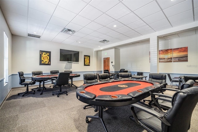 recreation room with a paneled ceiling, carpet, and visible vents