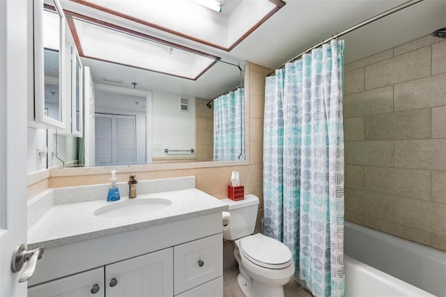 full bathroom with vanity, toilet, and shower / tub combo