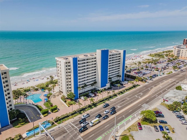 drone / aerial view with a beach view and a water view