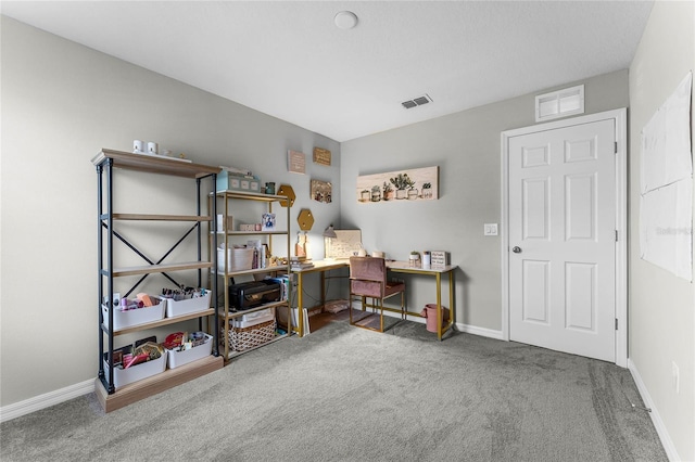 home office with carpet floors, visible vents, and baseboards