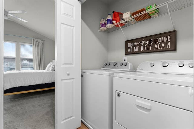 laundry area featuring a ceiling fan, laundry area, light colored carpet, and independent washer and dryer