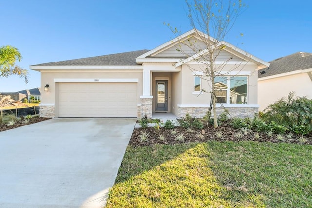 view of front of home featuring a garage and a front yard