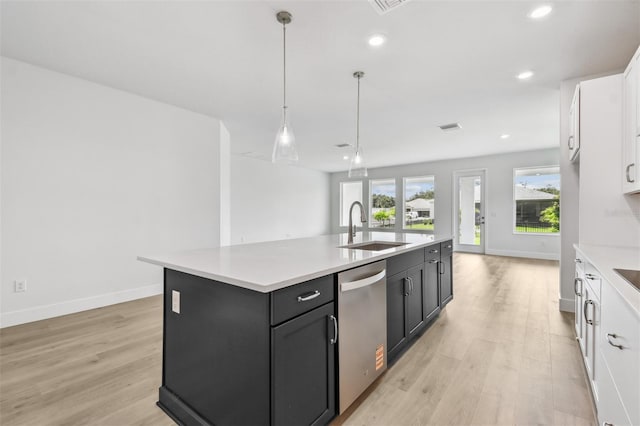 11885 Richmond Trl, Parrish, FL 34219 - kitchen with a sink, dishwasher, white cabinetry, light wood-style flooring, and recessed lighting