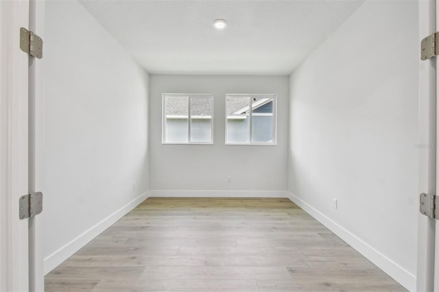 11885 Richmond Trl, Parrish, FL 34219 - spare room featuring light wood-style floors and baseboards