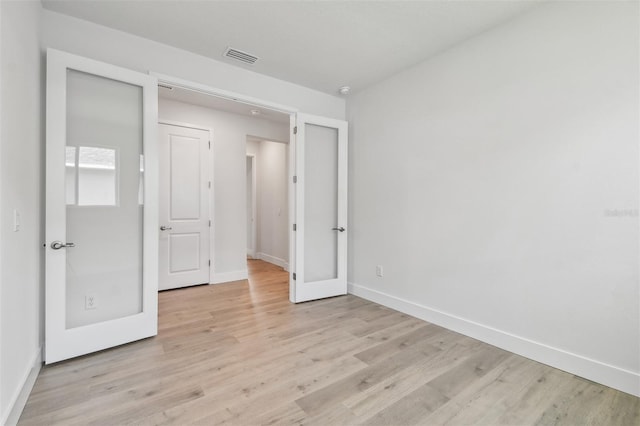 11885 Richmond Trl, Parrish, FL 34219 - unfurnished bedroom featuring baseboards and light wood-style flooring