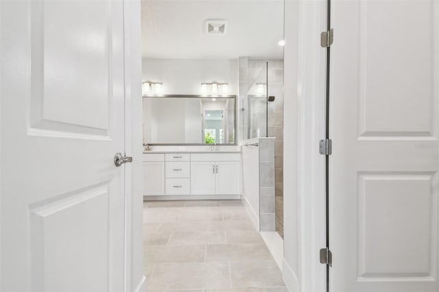 11885 Richmond Trl, Parrish, FL 34219 - full bathroom featuring vanity, a tile shower, and tile patterned flooring