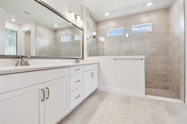 11885 Richmond Trl, Parrish, FL 34219 - bathroom featuring double vanity, walk in shower, tile patterned flooring, and recessed lighting