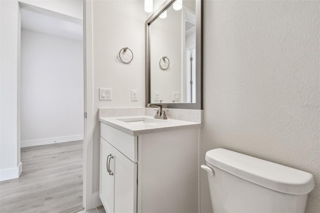 11885 Richmond Trl, Parrish, FL 34219 - bathroom featuring toilet, vanity, and wood finished floors